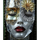 A close-up of a sculptural decorative grey marble face mask with a diamond eye patch and eye lids, red lips, and gold succulent eye browse accent set against a dark background with cactus-plants. Caviar surreal portrait by MizDragonfly.