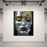 A rectangle wall art set in luxurious acrylic glass displayed on a large white gallery wall in a modern gallery space. The artwork features a close-up of a face with a clear mask with one eye covered with diamonds, and bright red lips, set against a dark background. 