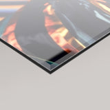 A close-up angled view of a 4mm glossy acrylic glass panel with a dark reflective surface showing warm orange and blue tones, set against a light grey background.