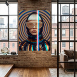 A large vertical canvas print featuring a stylized portrait of a woman with a platinum blonde bob, gold geometric sunglasses, and a metallic reflective outfit, displayed on a brick wall in a modern loft room with wood floors and large windows. 