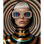 A stylized portrait of a person with a platinum blonde bob wearing oversized rhinestone-framed sunglasses with rainbow vertical stripes and a glossy black, gold and turquoise hooded outfit with a gold monogram at the neck, set against a yellow, green and black swirling concentric-circle background.