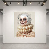 A large museum-grade framed artwork displayed on a white gallery wall, showing a surreal portrait of a woman with a white helmet-like headpiece, silver diamond accents, dark crystal eye masks with crystal tear droplets and a pearl-like caged ruff collar against a beige background.