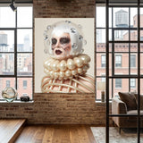 A large vertical wall art displayed in a modern loft-style room with exposed brick walls, wood floors, and large windows. The artwork depicts a surreal woman with a clear glass helmet, pale face, dark crystal eye patches with crystal tears, and a voluminous pearl-like collar and ribbed body against a light beige background.