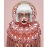 A stylized portrait of a person with short white hair, a sparkly face mask, with crystal tears, dark red lipstick, and a large iridescent pink collar made of bubble-like glass translucent elements, set against a soft pink background. 