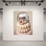 A surreal museum-grade artwork displayed on a large white wall in a gallery. The work features a woman with a clear glass dome helmet, a large cream-colored balloon-like glass collar, and red lips set against a beige background.