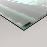 A close-up of a 4mm transparent glass panel with a frosted surface featuring details of MizDragonfly's surreal Evian artwork.