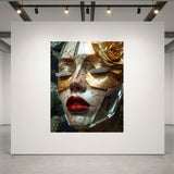 A large framed art print displayed on a large white gallery wall in a modern space. The artwork shows a close-up portrait of a woman's face wearing gold leaf eye patches, gold flower accent and silver diamond eyelashes, plus vivid red lips.