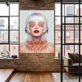 A large vertical wall art print featuring a surreal portrait of a woman with a metallic, wire-like head and glowing red lips, displayed on a brick wall in a modern loft room with wood floors and large windows.