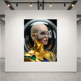 A large wall art print displayed on a white gallery wall, featuring a stylized portrait of a woman with a metallic gold bodice and silver geometric eyewear with dazzling diamond pavé and gold M monogram. Diamonds earrings and ear cuffs completes the look. Model is encased in a glass orb set agains a dark circular background. The print is shown in a modern gallery space with track lighting and a concrete floor.