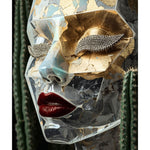 A sculptural face mask with a face sculpture with cracked clear glass-like texture, metallic gold leaf details, rhinestone-embellished eye lashes, and glossy red lips, framed by dark green cacti against a dark background. Nanogold limited surreal artwork by MizDragonfly.