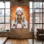 A large canvas wall art print featuring a surreal portrait of a stylized person with a white head covering, white gloves, and a mouth dripping with gold, holding their face with both hands. Face is covered with kisses with ears and wrist adorned with candied geometric jewelry. Scene is set against a textured orange brick wall in a modern loft-style room with wood floors and large windows.